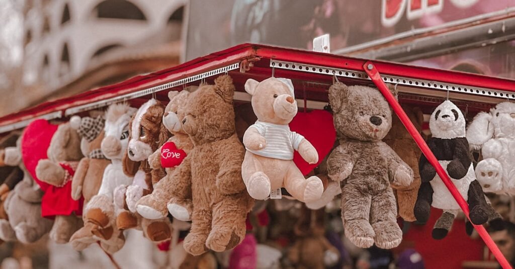 Vibrant plush toy display on city street vendor stall with urban background.